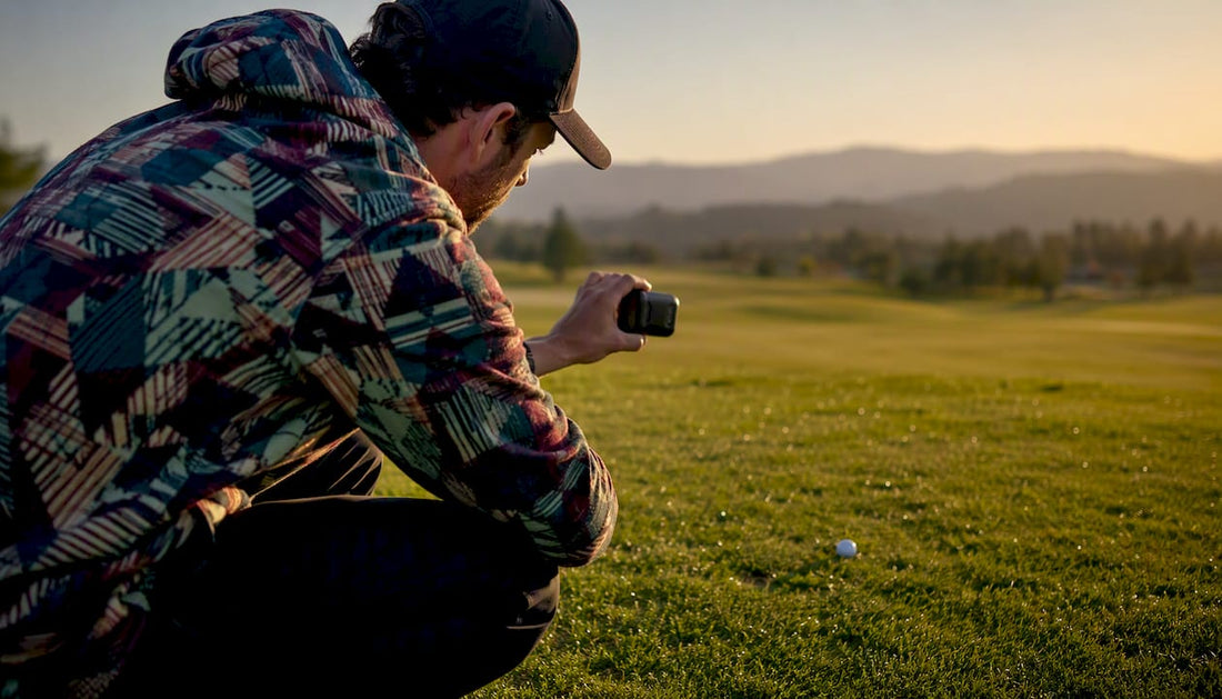 Golfer measuring golf ball carry distance