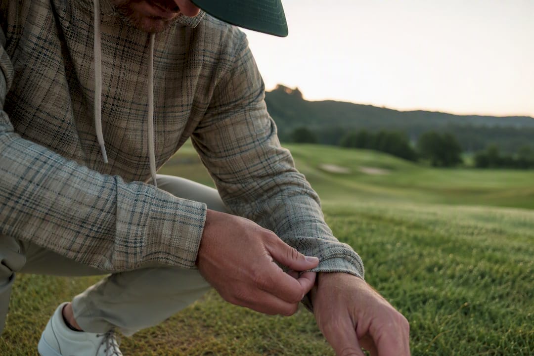 Focus on plaid golf hoodie fabric and cuff
