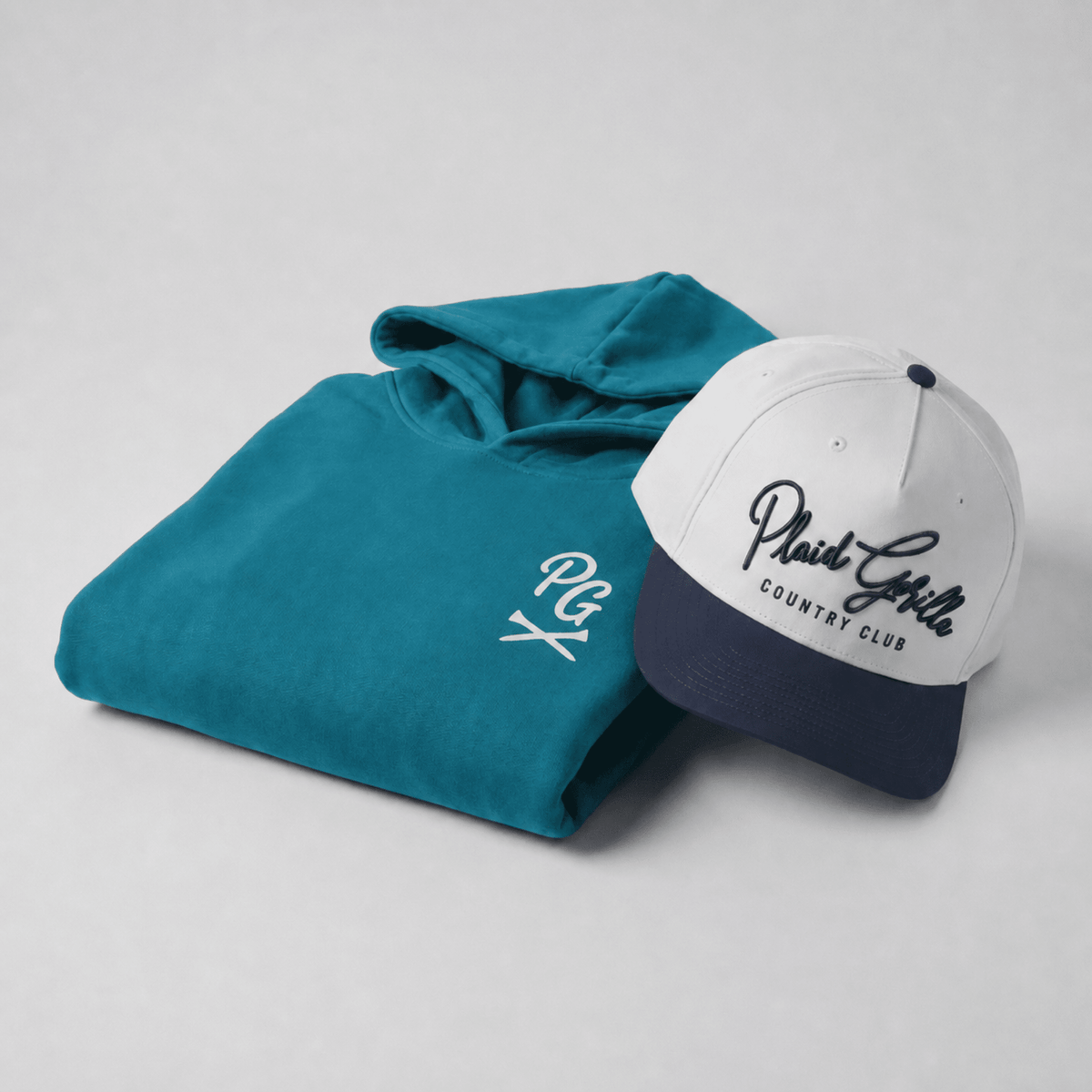 The Range Kit bundle from Plaid Gorilla Golf — Country Club Snapback and Bogey Enthusiast Hoodie